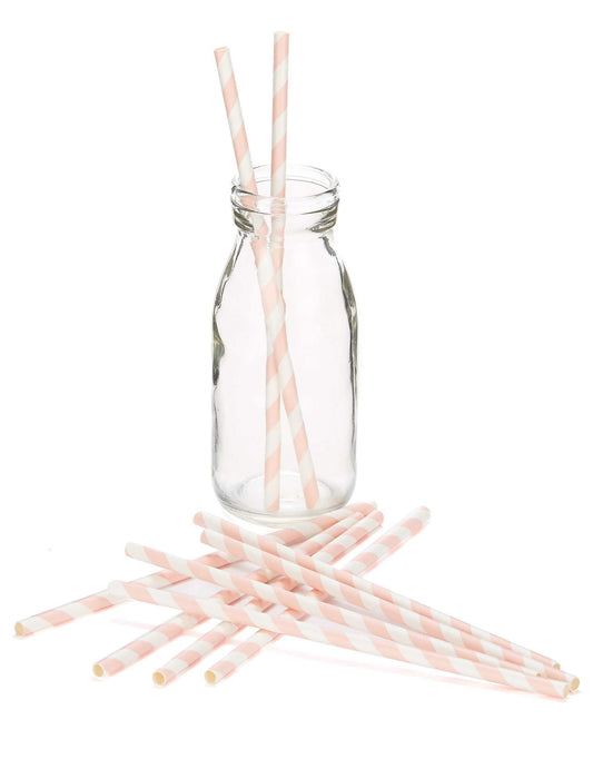 Mise en situation dans une bouteille des pailles en carton rayées pour boissons froides rose et blanc