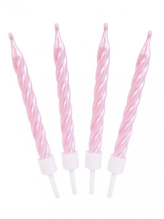 Gros plan des bougies d'anniversaire spirales roses nacrées