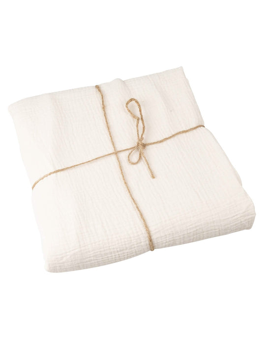 Vue pliée avec ficelle de la nappe en gaze de coton style bohème crème