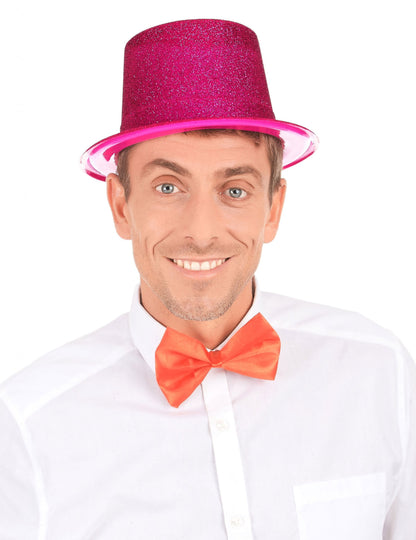 Vue de face du chapeau haut de forme pailleté pour adulte fuschia