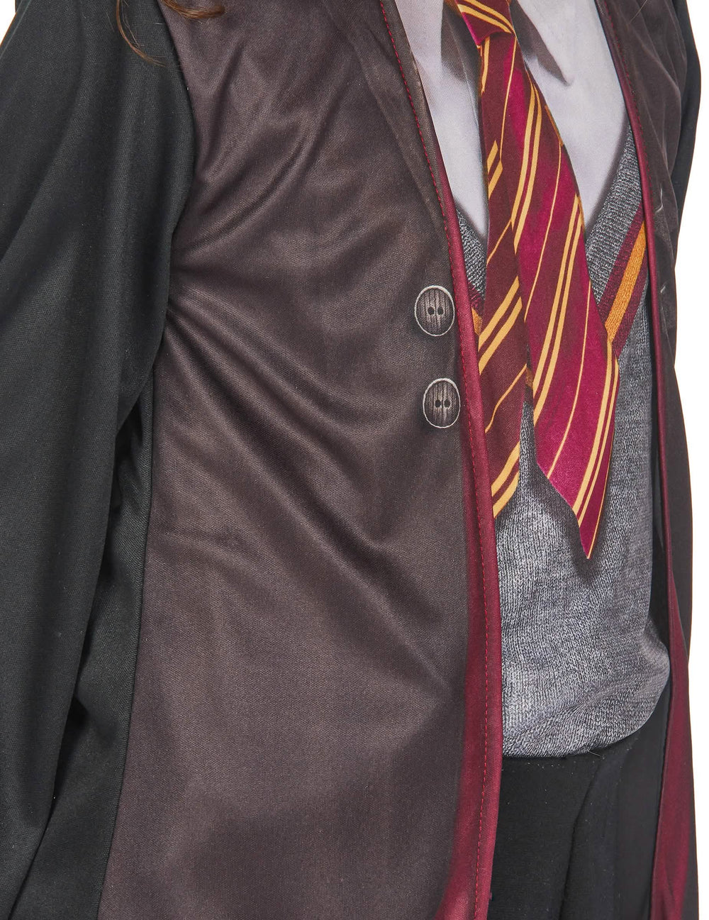 Gros plan sur les boutons imprimés et la cravate du coffret déguisement et accessoires Harry Potter