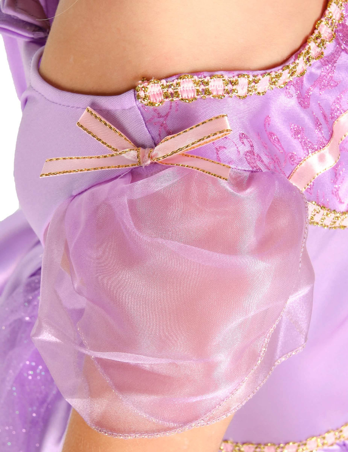 Détail de la manche bouffante et du nœud rose du déguisement deluxe Raiponce™ pour fille