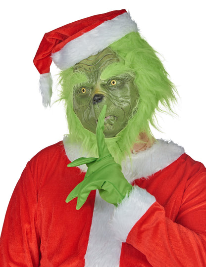 Gros plan sur le gant vert et le geste de silence du déguisement monstre vert grincheux
