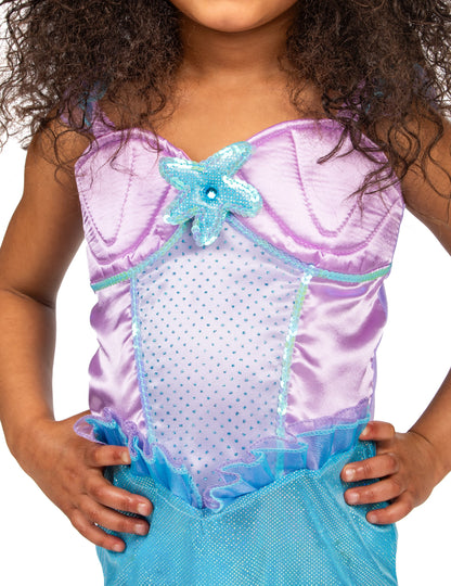 Détail de l'étoile de mer à paillettes du bustier du déguisement de sirène pour fille