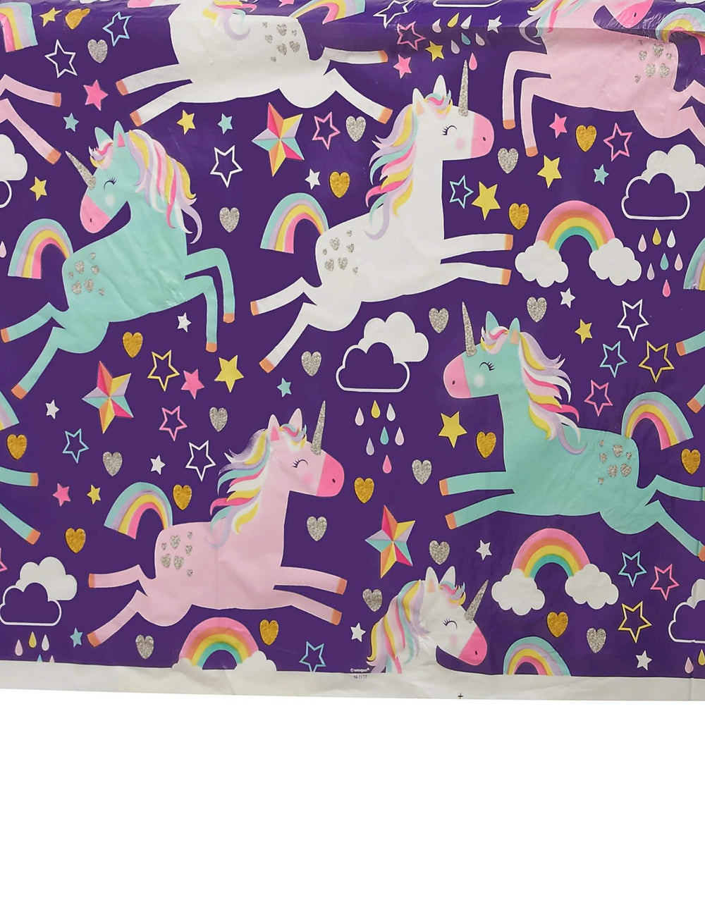 Детайли на мотивите на еднорози и дъги на пластмасовата покривка licorne party