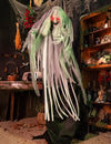 Sorcière animée pour décoration d'Halloween verte et grise aux yeux rouges